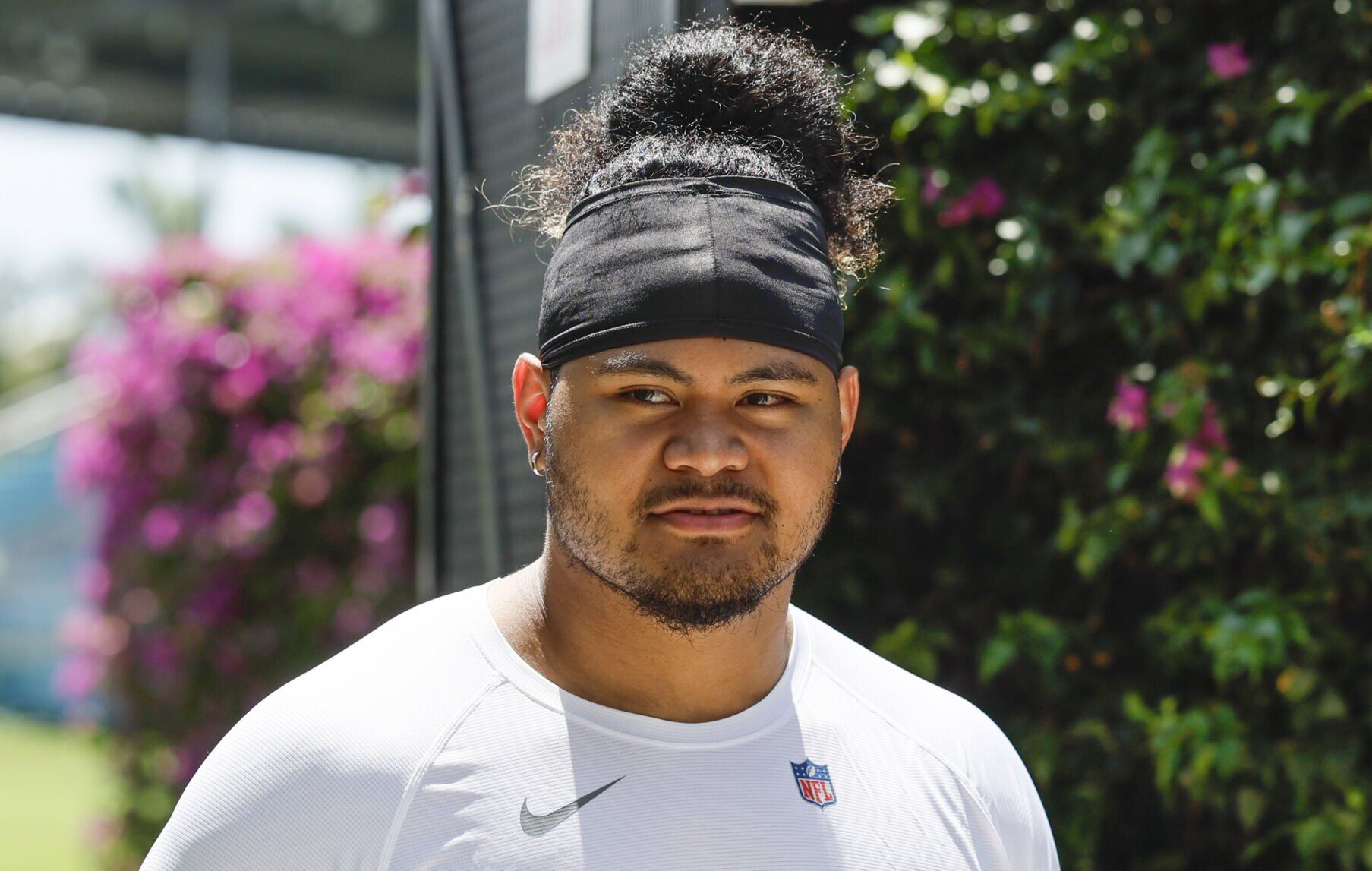 Miami Dolphins offensive lineman Jonah Savaiinaea arrives to speak to reporters during Dolphins rookie minicamp at the Baptist Health Training Complex in Miami Gardens, Florida on Friday, May 9, 2025.